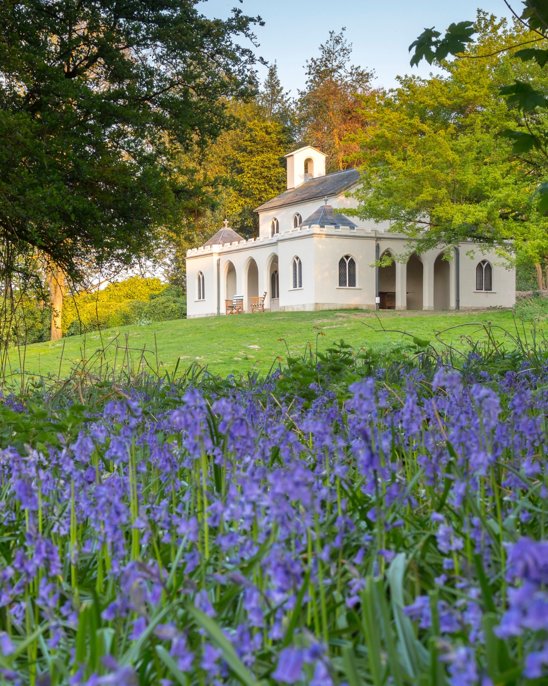 An ornate white folly surrounded by trees