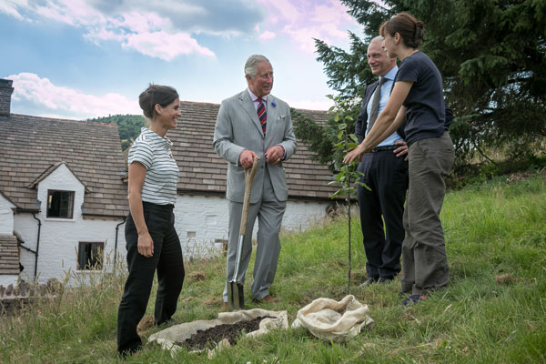 HRH The Prince of Wales plants a rare apple tree during his visit to Llwyn Celyn July 2018