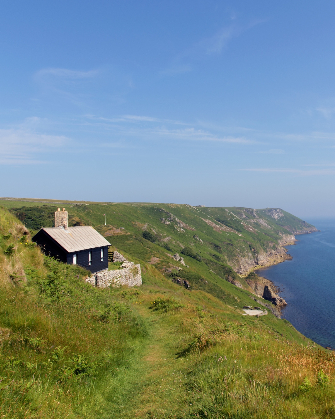 A Lundy fisherman's hut on a cliff overlooking the sea