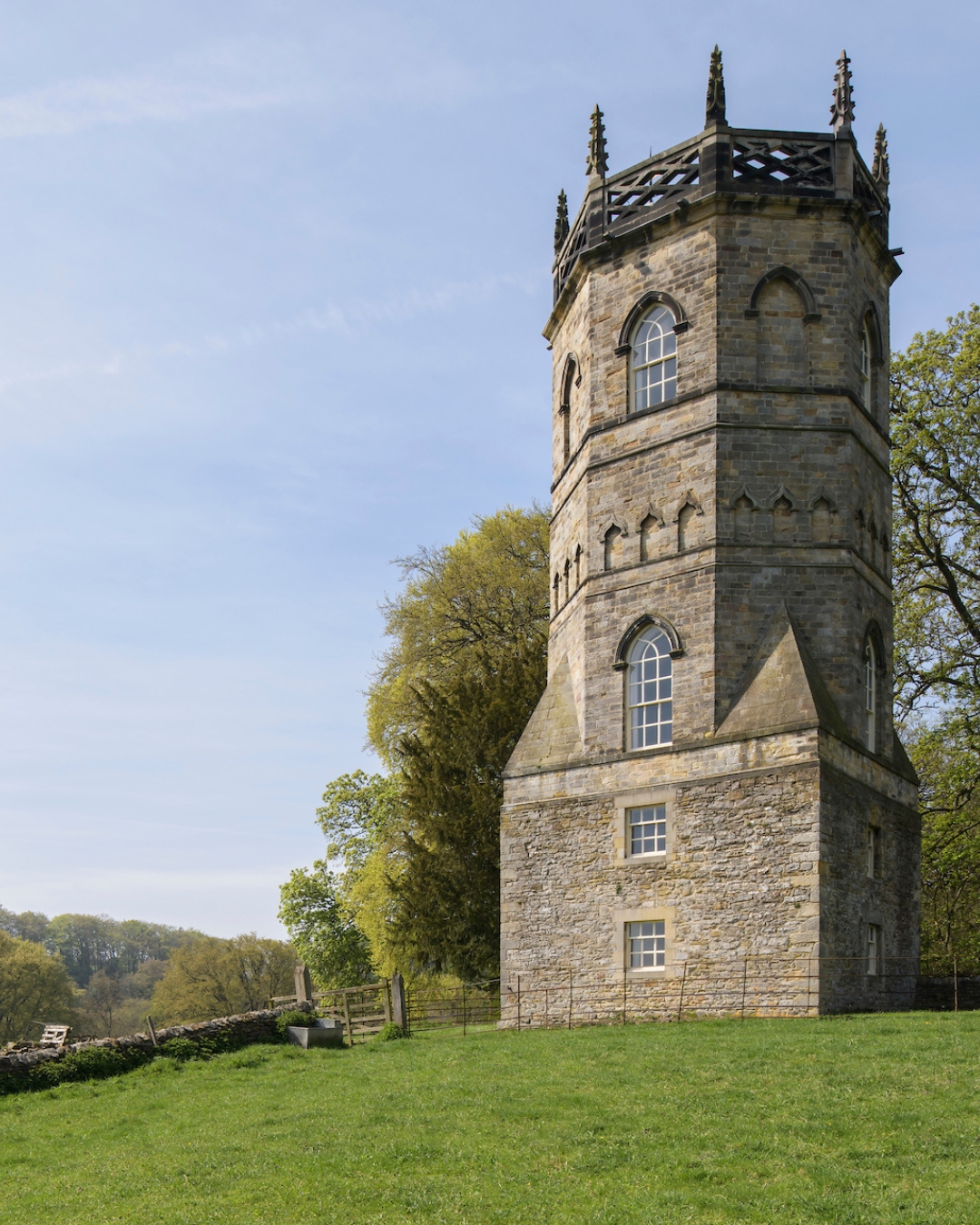 A turreted folly surrounded by trees