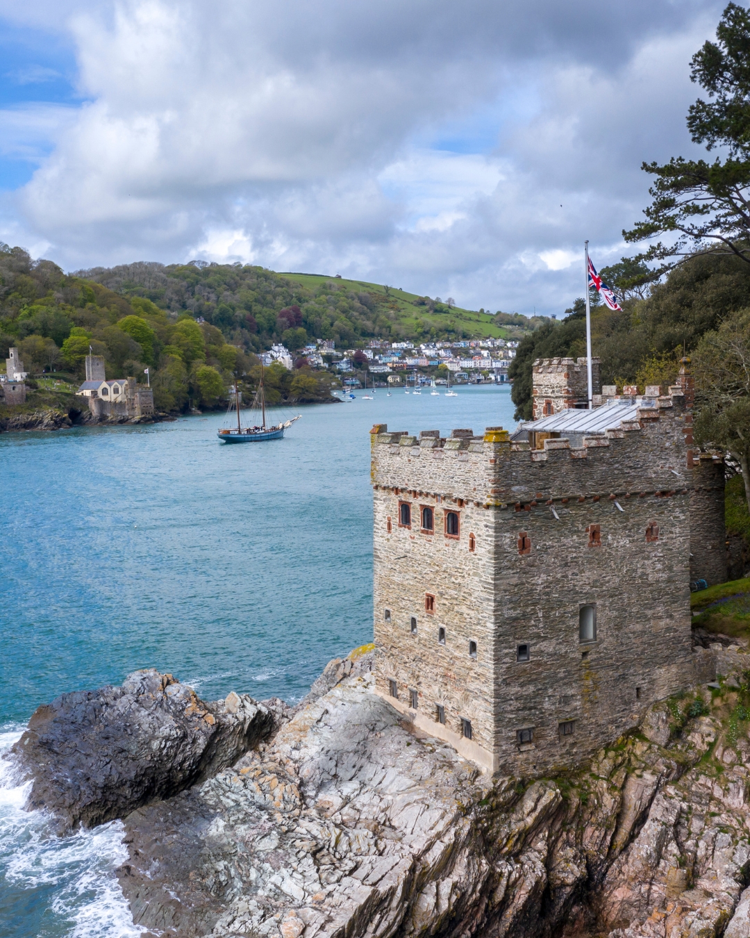 A small castle on a rocky outcrop in the sea