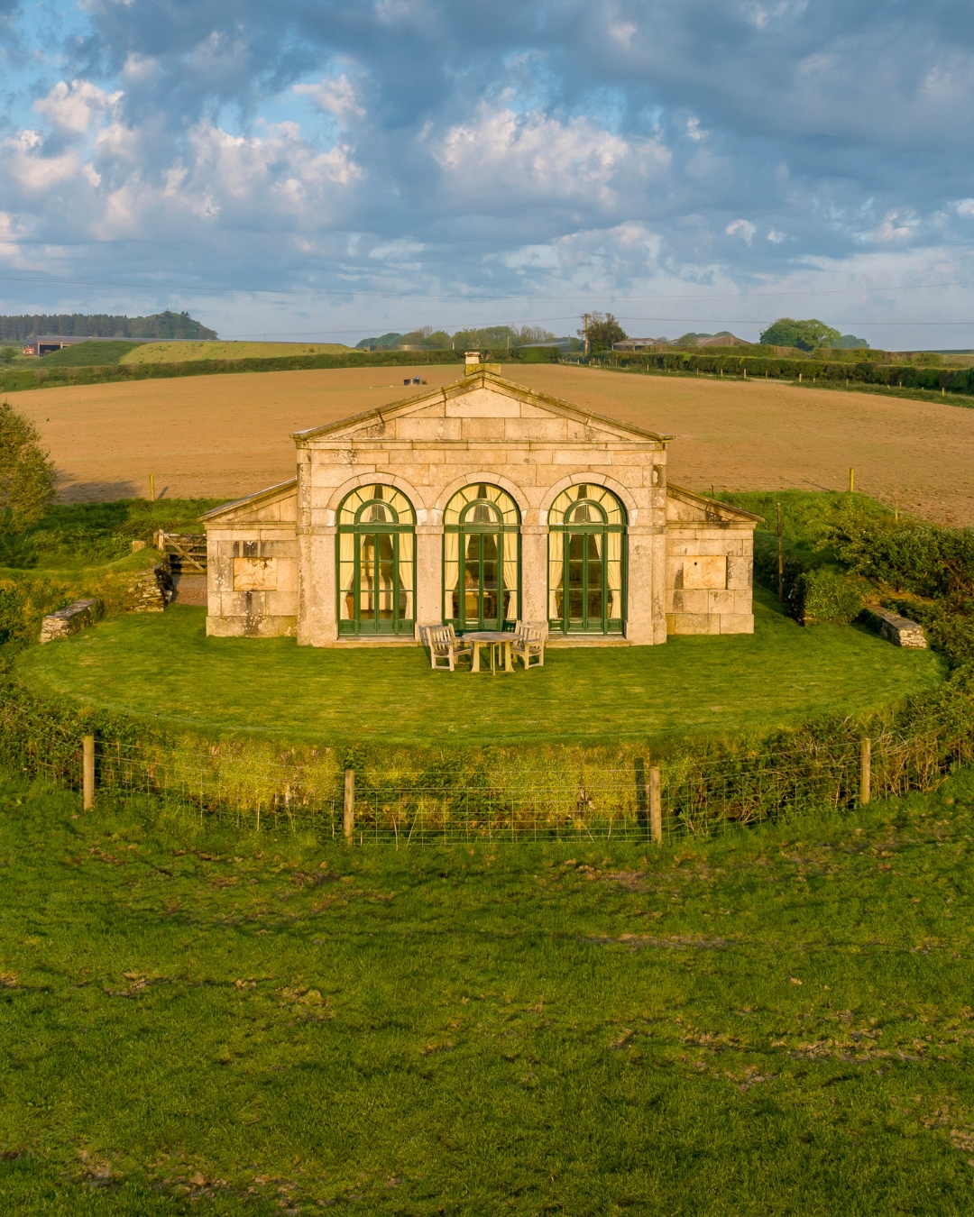 A small folly surrounded by fields