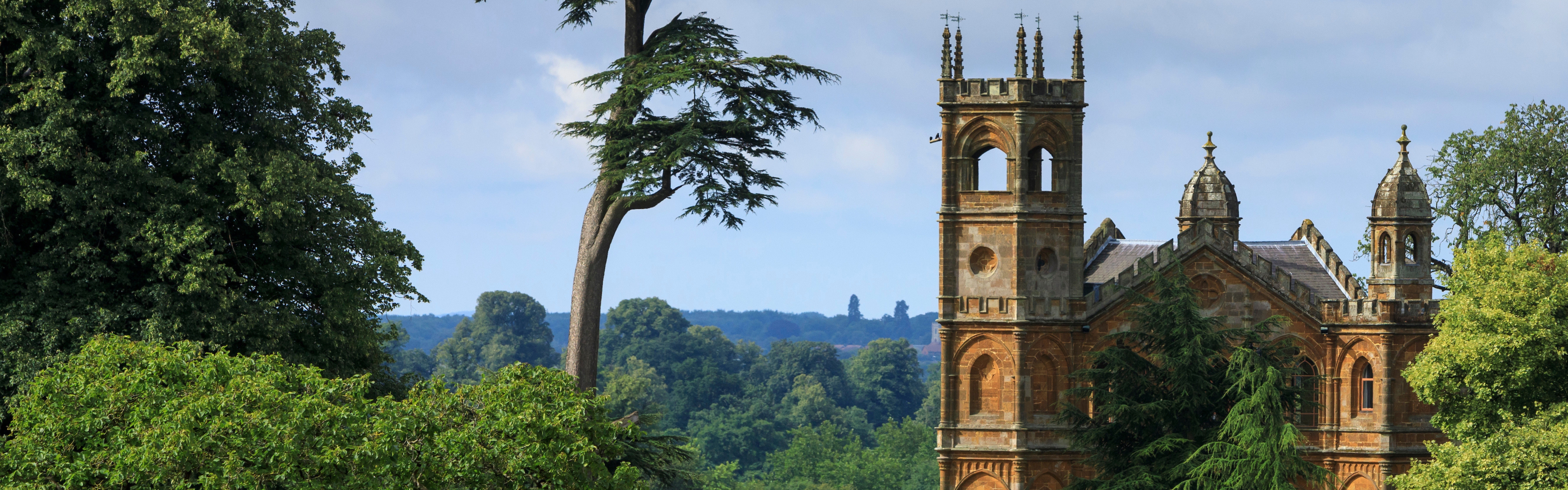 An ornamental folly surrounded by green landscape