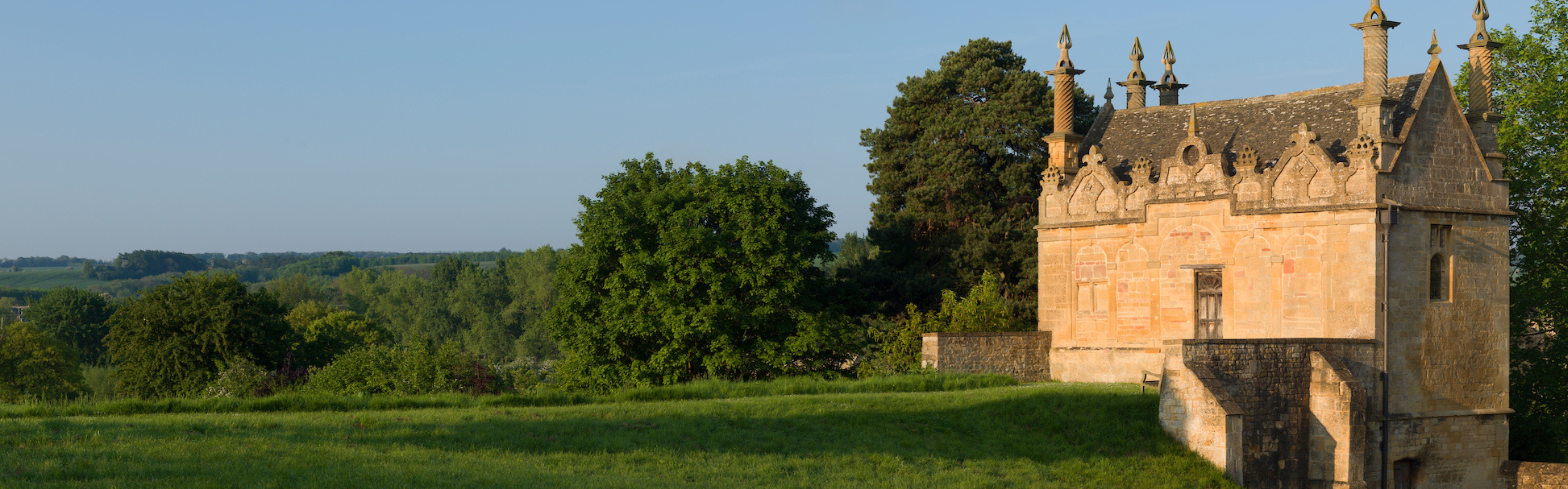 An ornamental folly surrounded by green landscape